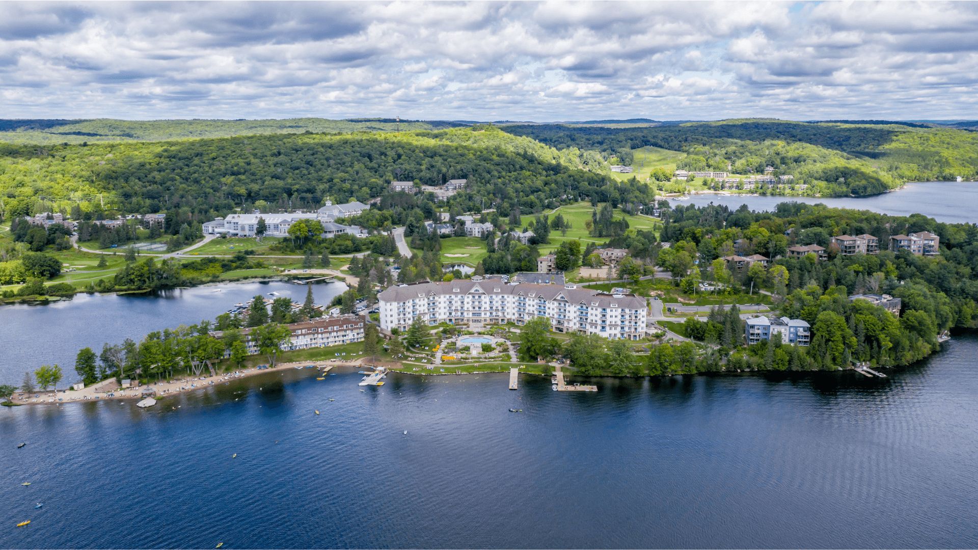 An aerial view over the lake and grounds at Deerhurst Resort