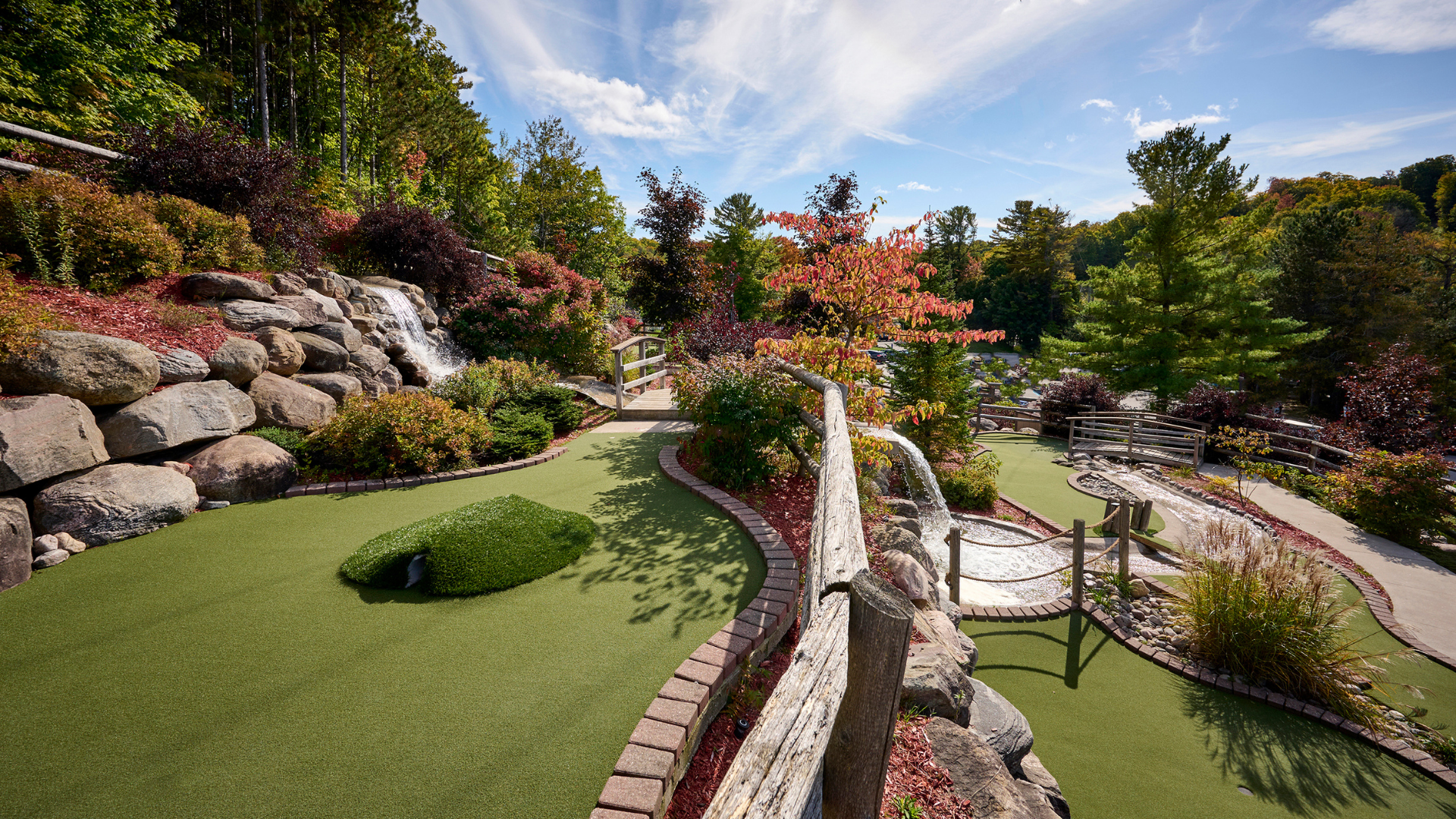 A mini golf course surrounded by rock and trees, at Horseshoe Resort